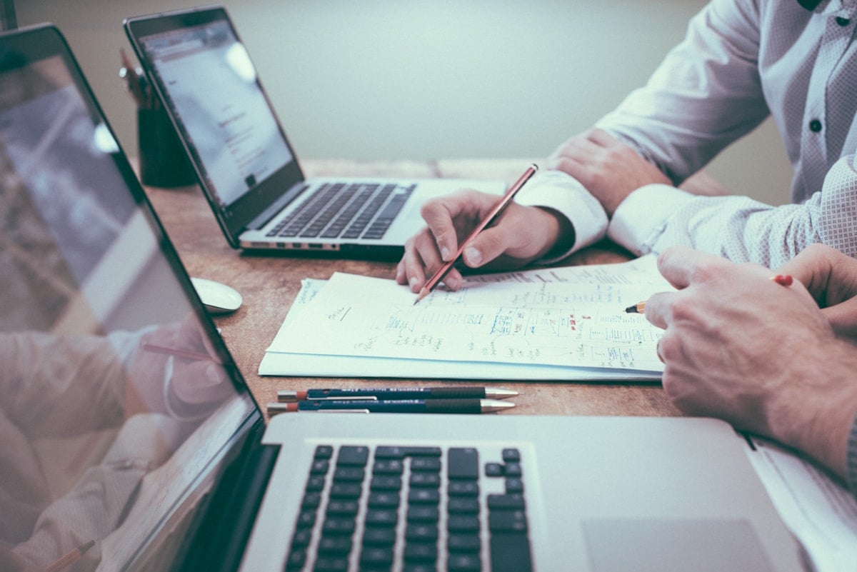 Vendor team reviewing a pharmaceutical customer supplier qualification questionnaire